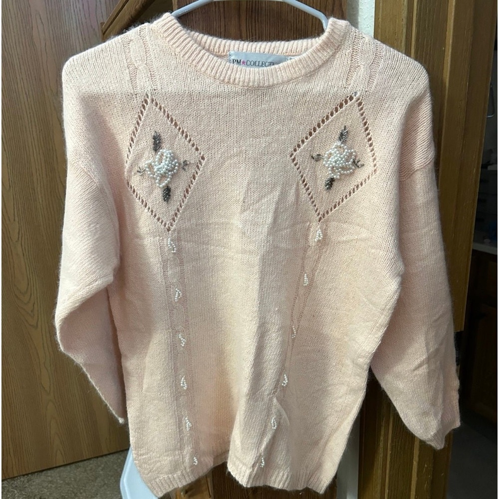 Women’s Sweater. Beautiful pink color intricate designs